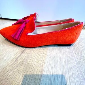 Orange and pink faux suede moccasin loafers with pink tassels